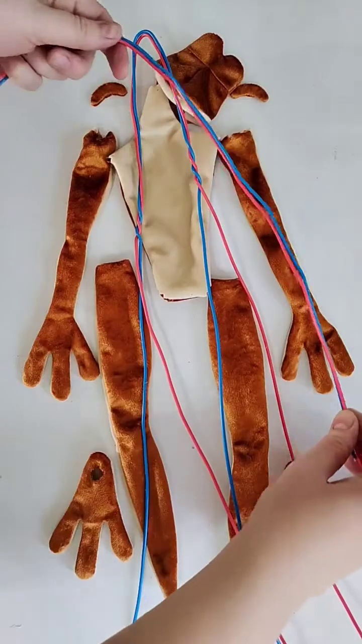 Patila frog plush pieces and wire frame Patila frog plush pieces in orange and cream with the wire frame laid in before sewing, handmade