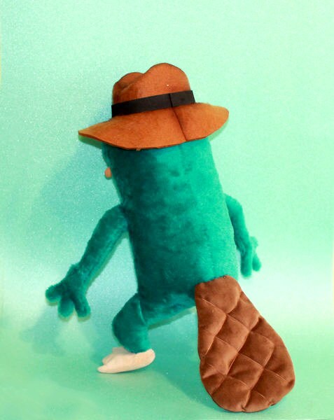 Perry the Platypus plush with quilted tail Handmade Perry the Platypus plush with a flat brown quilted tail and peach feet, sewn to order