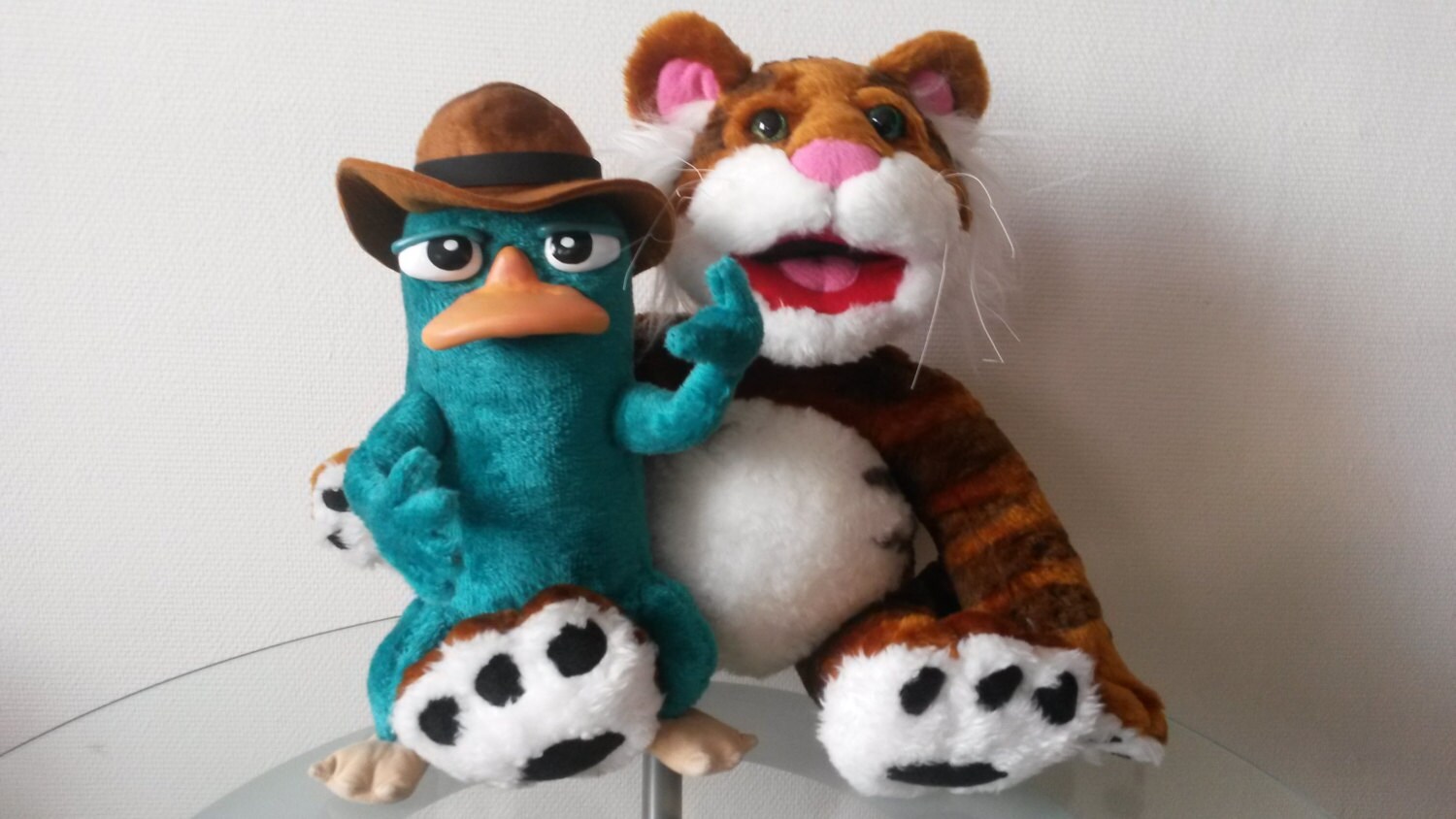 Perry the Platypus plush with a tiger plush Custom Perry the Platypus plush in a brown fedora sitting next to a striped tiger plush, handmade