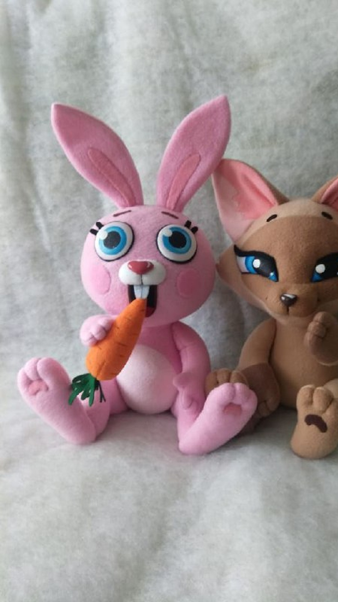 Pink bunny sticker plush with blue eyes, buck teeth and a soft orange carrot, handmade to order