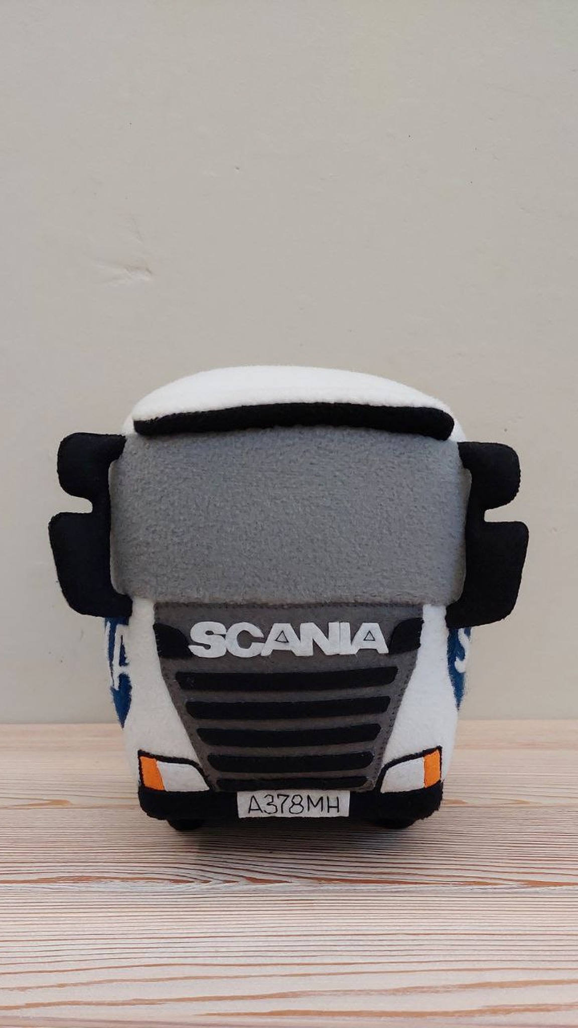 Plush truck cab with sewn grille, number plate and black mirrors, custom made to order for a company