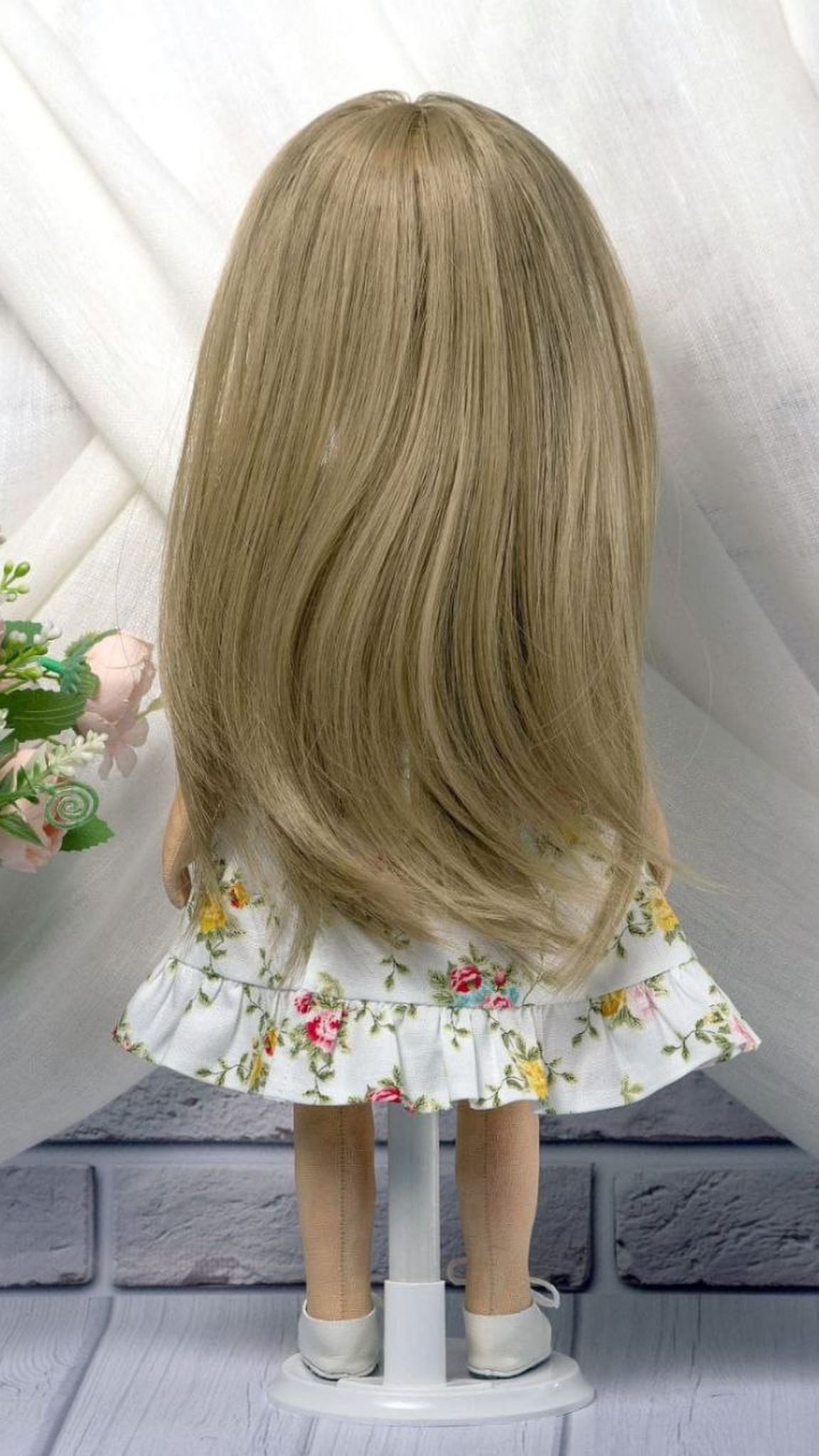Long straight dark-blonde hair on a custom girl portrait doll in a ruffled rose-print dress, handmade to order