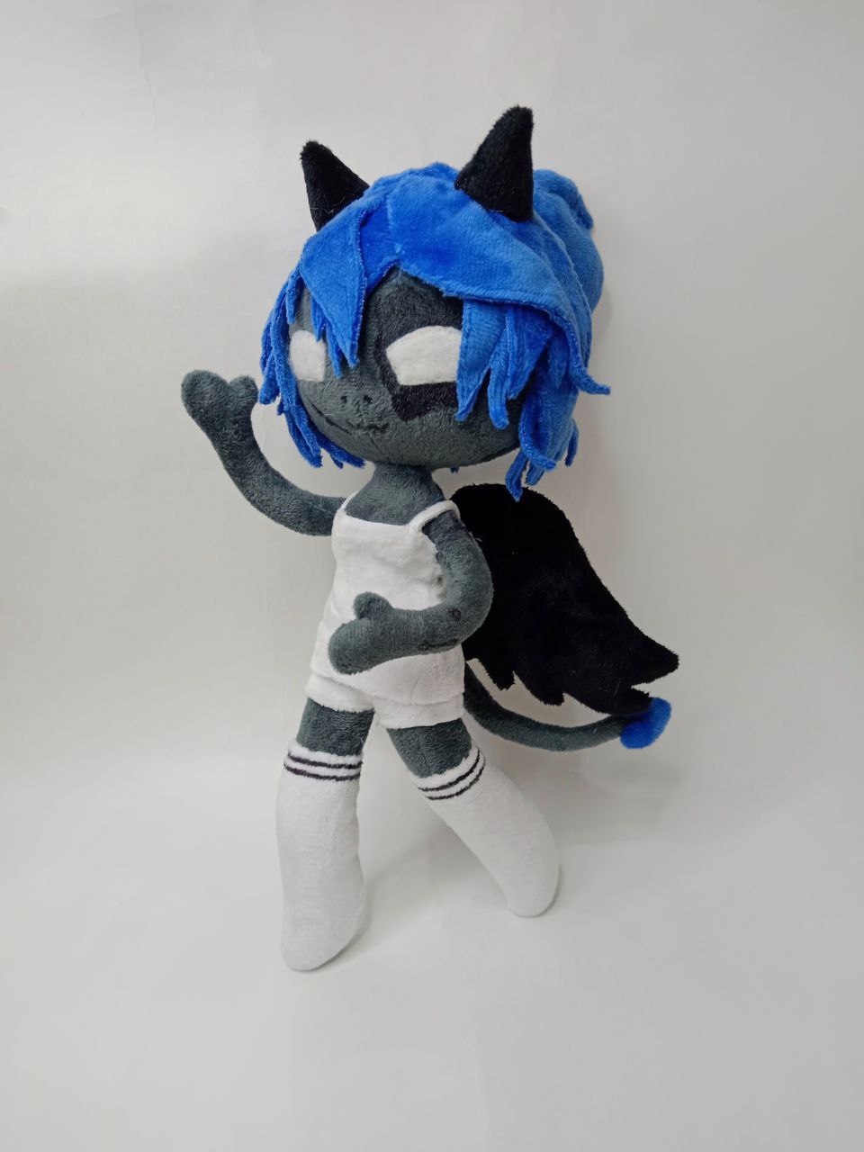 Poseable OC doll Kayla waving Poseable OC doll Kayla made to order, bendable arm raised in a wave, demon girl plush with black wings