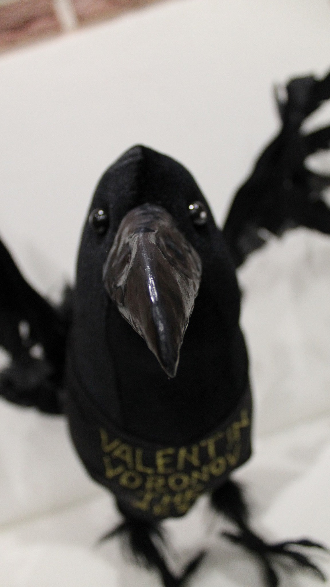 Poseable raven plush with raised wings and a sculpted beak, a custom velvet bird handmade to order