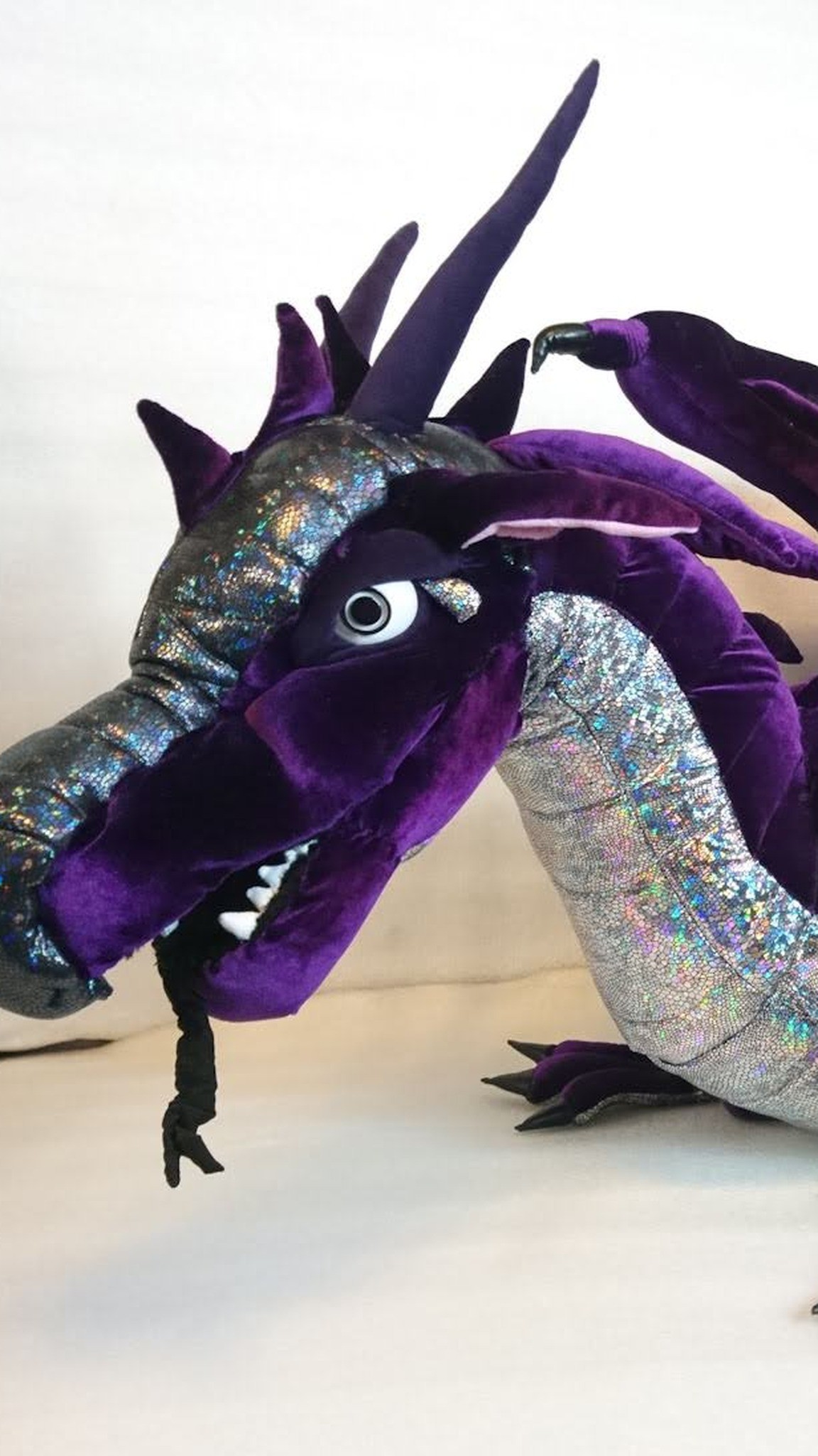 Purple dragon plush with grumpy white eyes and a silver holographic neck, handmade to order