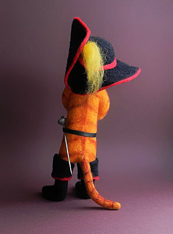 Puss in Boots felted toy with sword and tail Shrek Puss in Boots felted toy with a striped tail, a rapier at the belt and a plumed hat, made to order