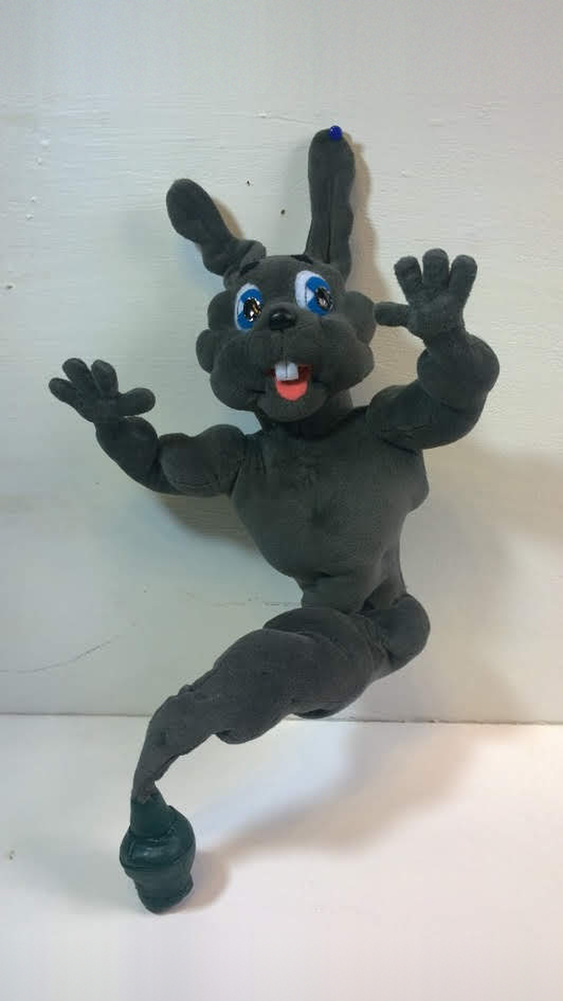 Rabbit genie plush waving both hands, grey body, blue eyes and buck teeth, green bottle tail, handmade to order