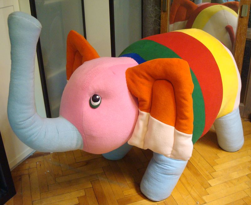 Rainbow-striped elephant plush from a kid’s art Rainbow-striped elephant plush with a pink head and orange ears, custom made from a 6-year-old's drawing