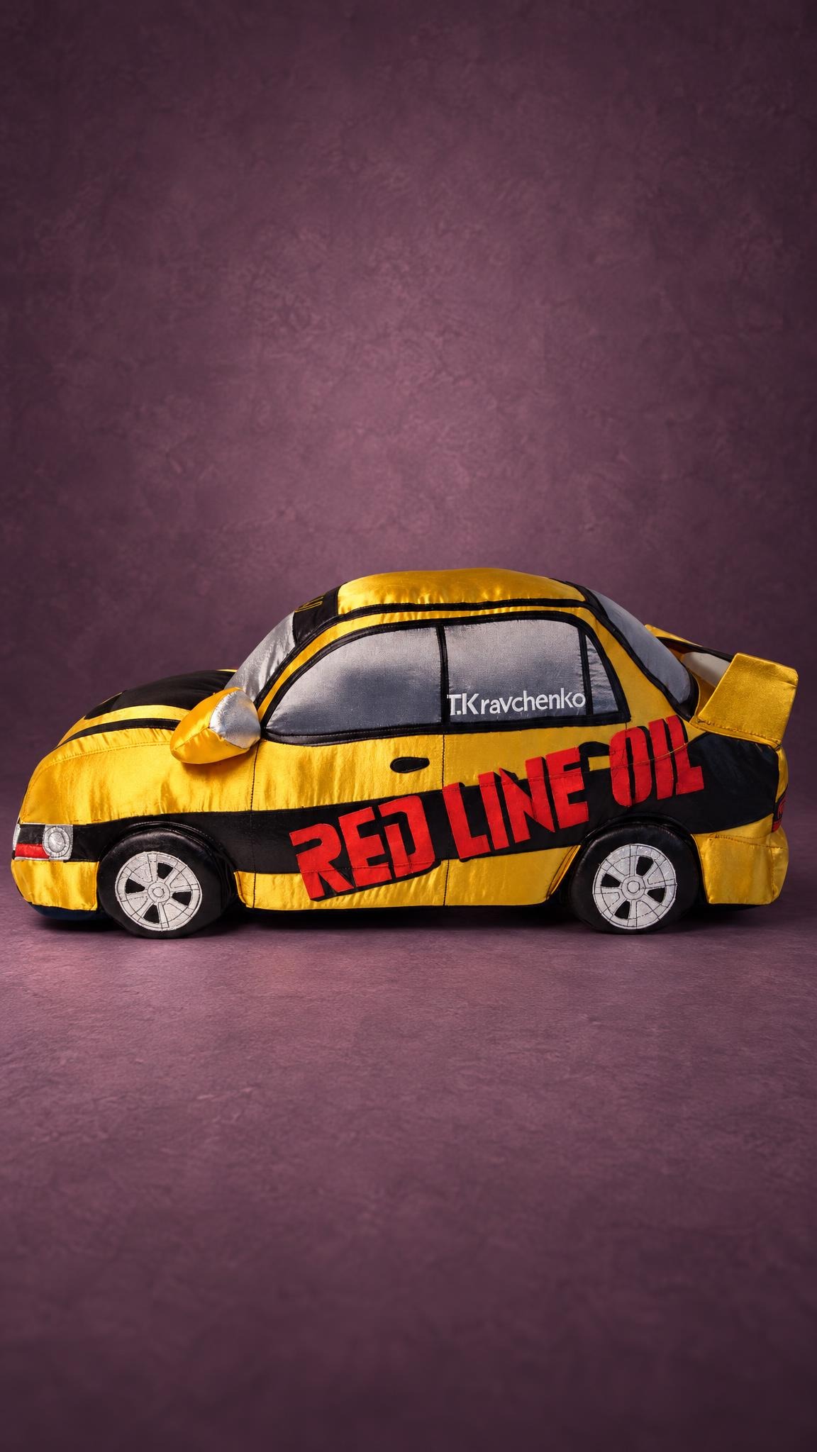 Yellow and black rally car plush with sponsor letters, a driver name and embroidered wheels, made to order