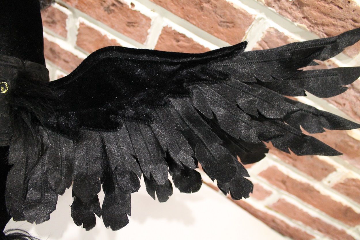 Raven plush wing, velvet and feathers Wing of a custom raven plush: black velvet top and layered glossy fabric feathers, each cut by hand