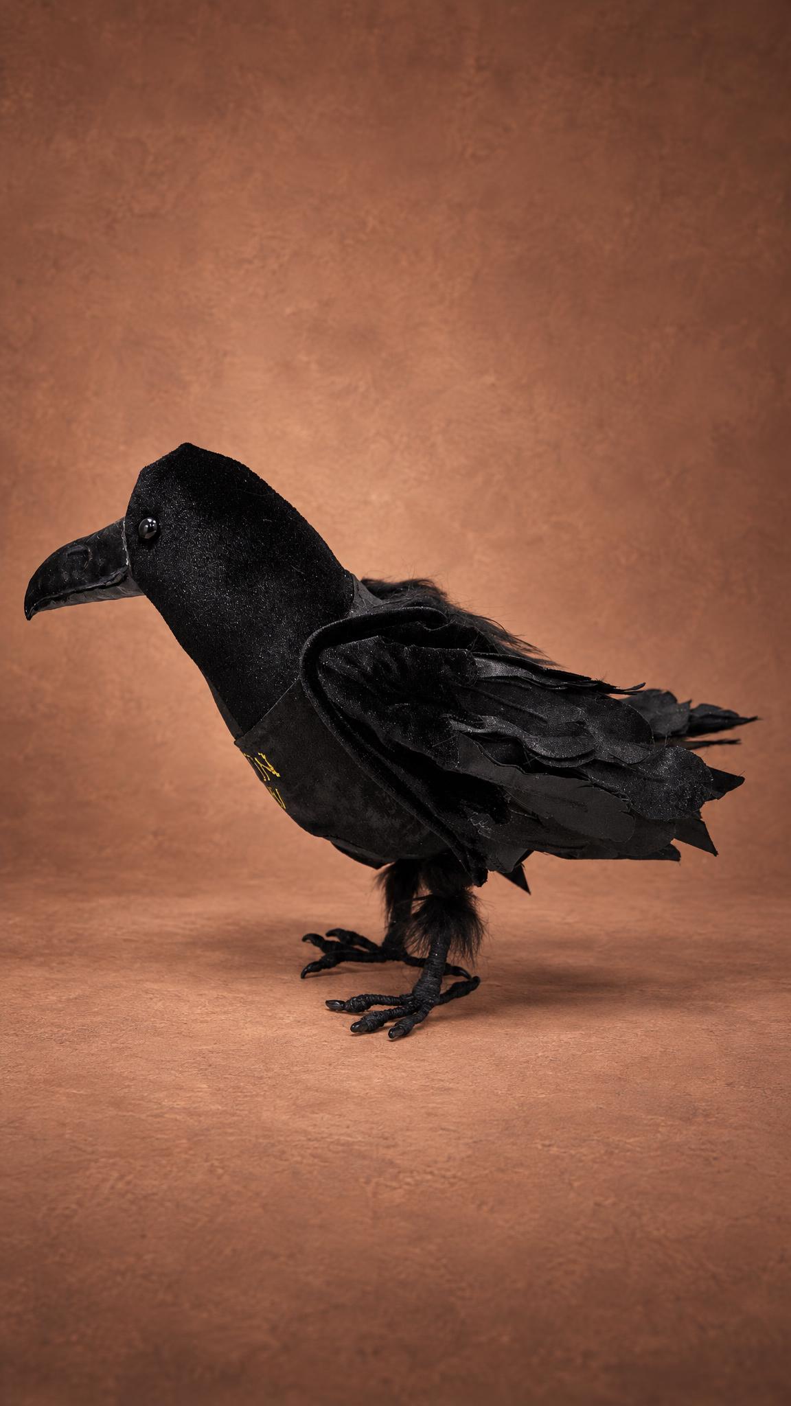 Black velvet raven plush standing on its own feet, a custom poseable bird sewn by hand to order