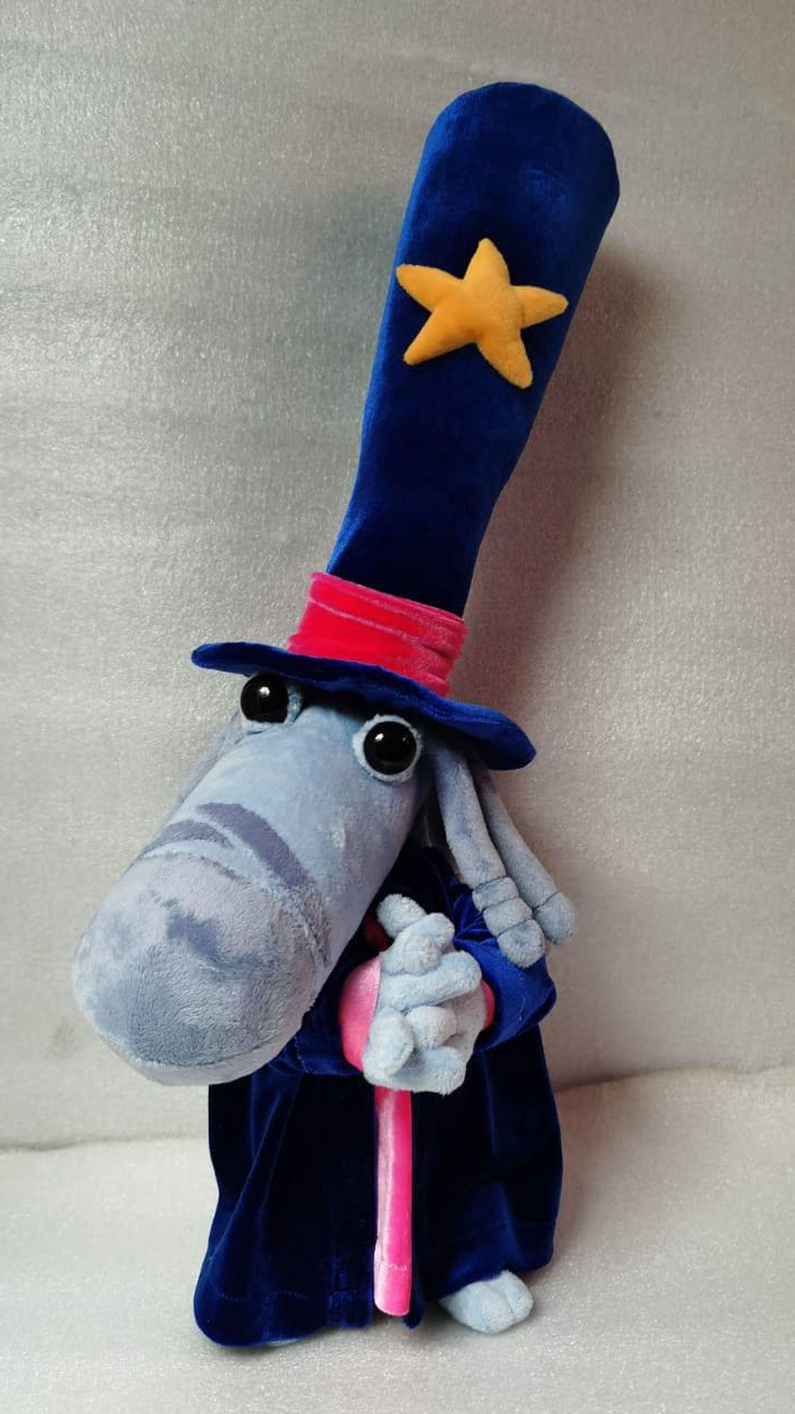 Rayman Magician Teensy plush with hands folded over his pink shirt and a long striped nose, custom made to order