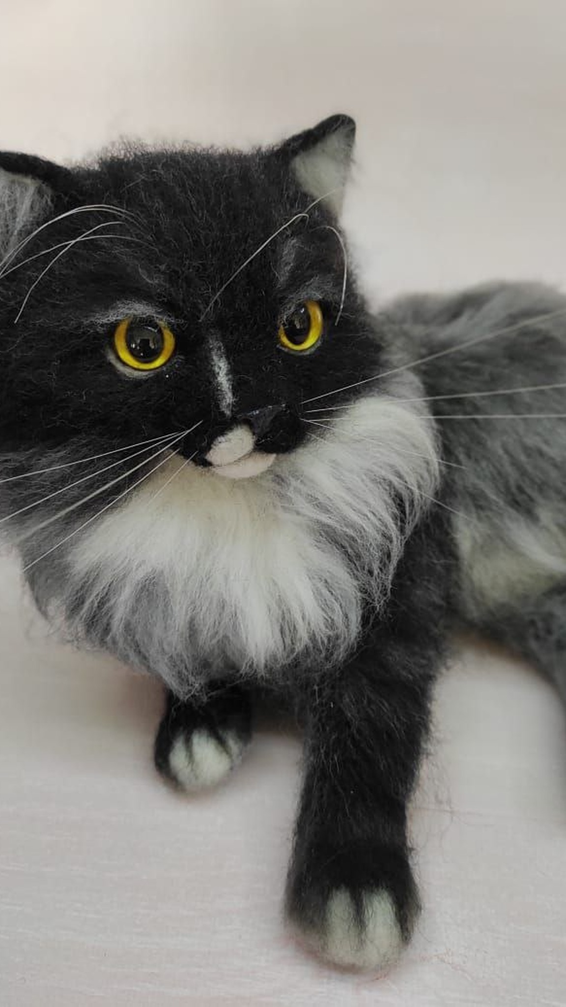 Handmade fluffy cat plush with amber glass eyes, long white whiskers and a white ruff, sewn to order