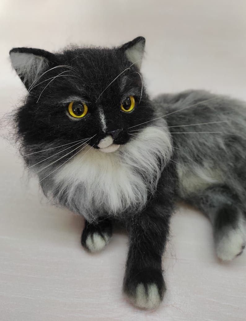 Fluffy cat plush with amber eyes Handmade fluffy cat plush with amber glass eyes, long white whiskers and a white ruff, sewn to order