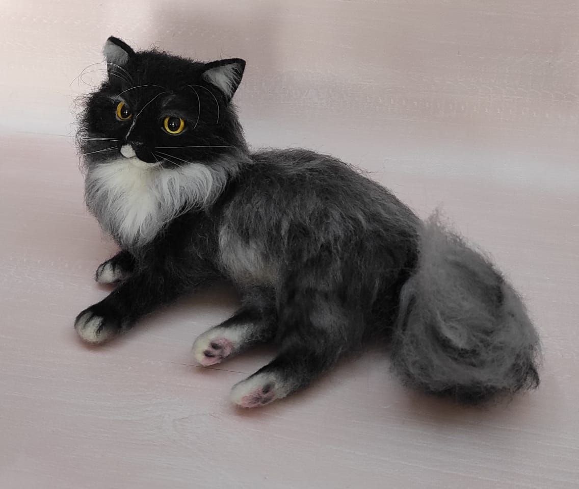 Fluffy grey cat plush with pink toe pads Fluffy grey cat plush with a curled tail and pink toe pads on white paws, sewn to order