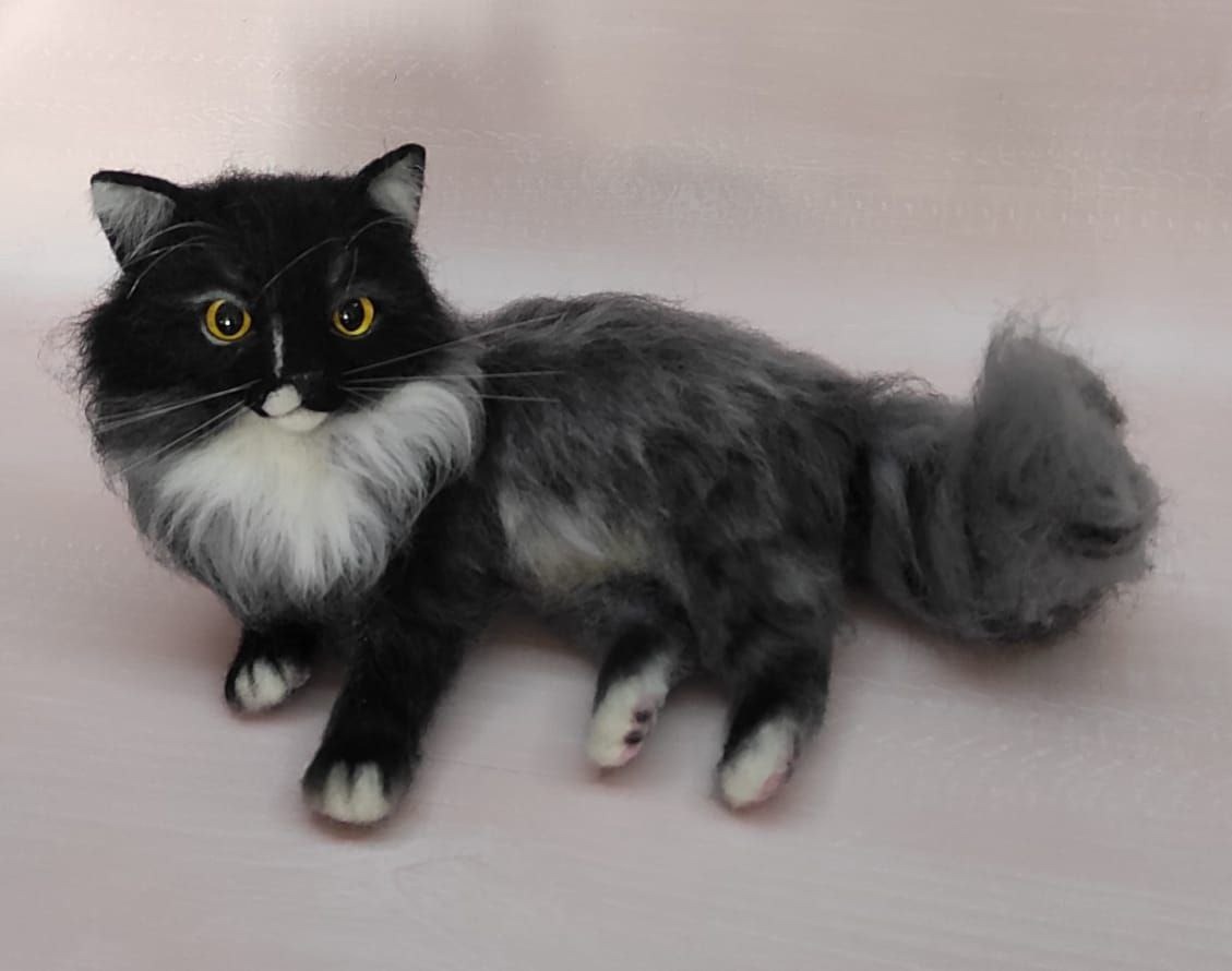 Long-haired smoke cat plush lying down Long-haired smoke cat plush lying with paws forward and a fluffy grey tail, handmade to order