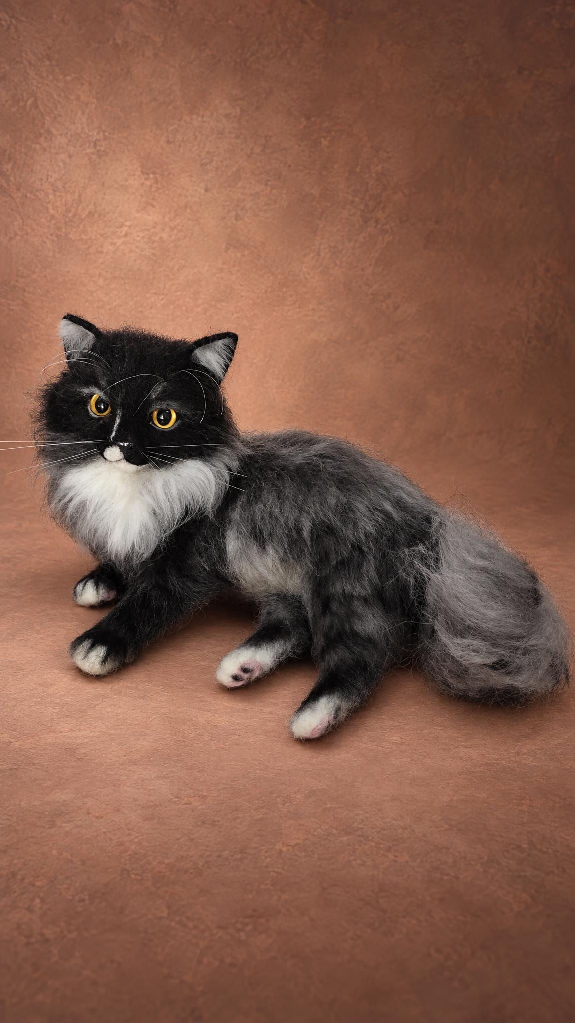 Custom long-haired cat plush lying down, black head, white bib and a big grey tail, handmade to order