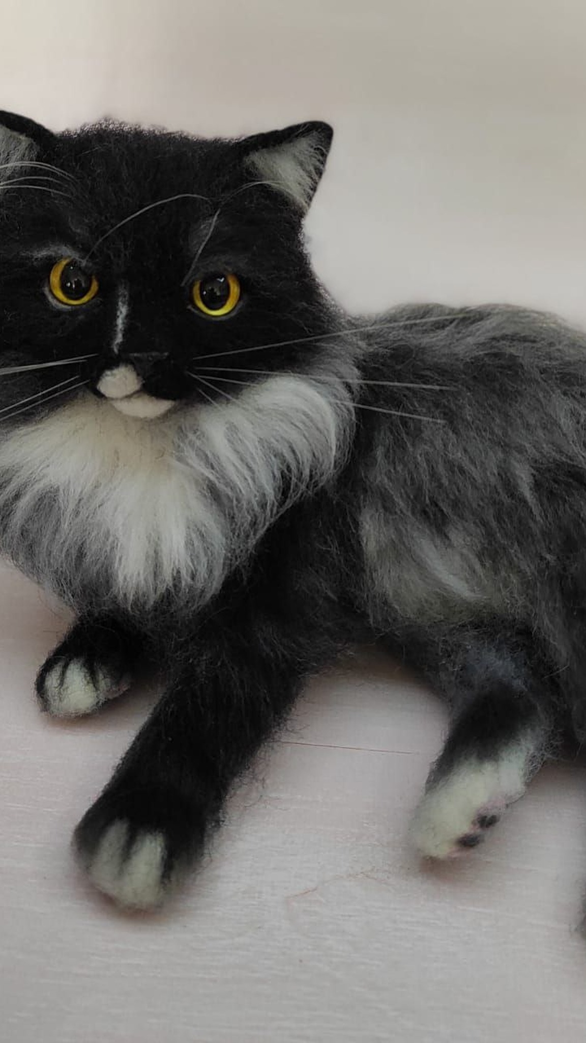 Realistic cat plush with a black face, white muzzle spot and white-tipped paws, made to order
