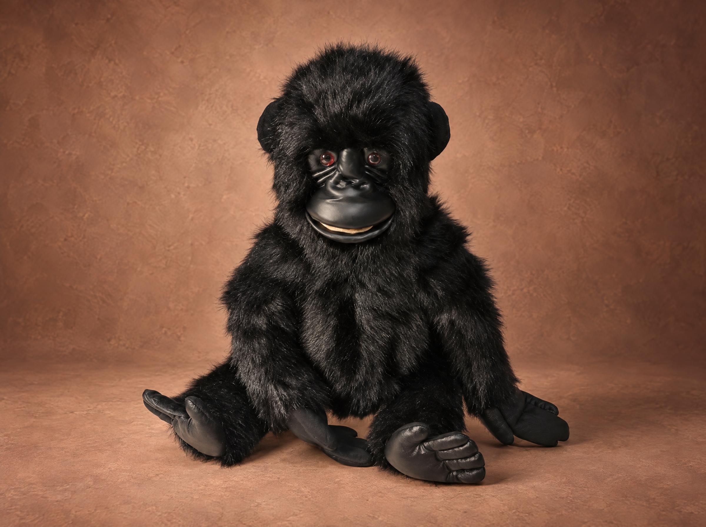 Realistic gorilla plush: baby gorilla in long black faux fur with faux leather hands and feet, handmade to order