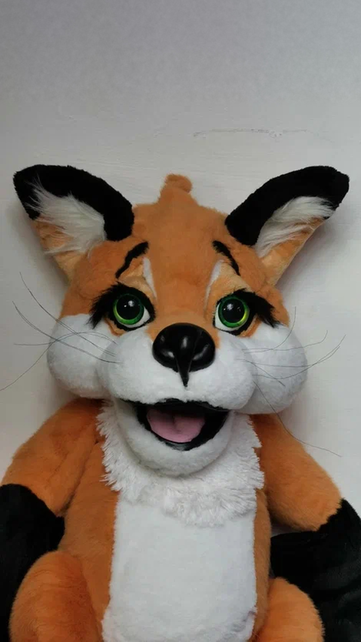 Custom red fox plush from a drawing: green eyes, black lashes and a wide open grin, sewn by hand to order