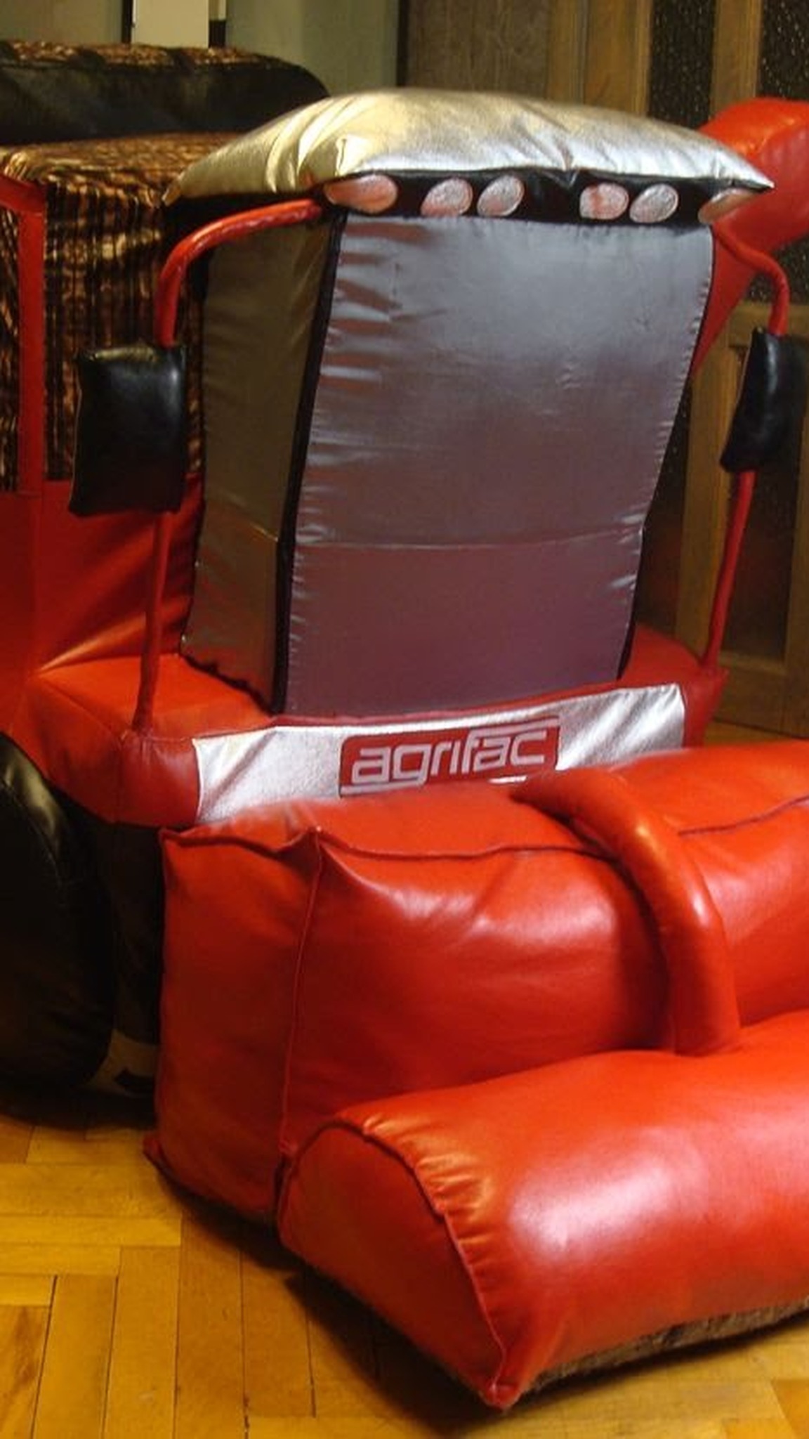 Red harvester plush with a silver cab, round roof lights and a soft cushion front end, made to order