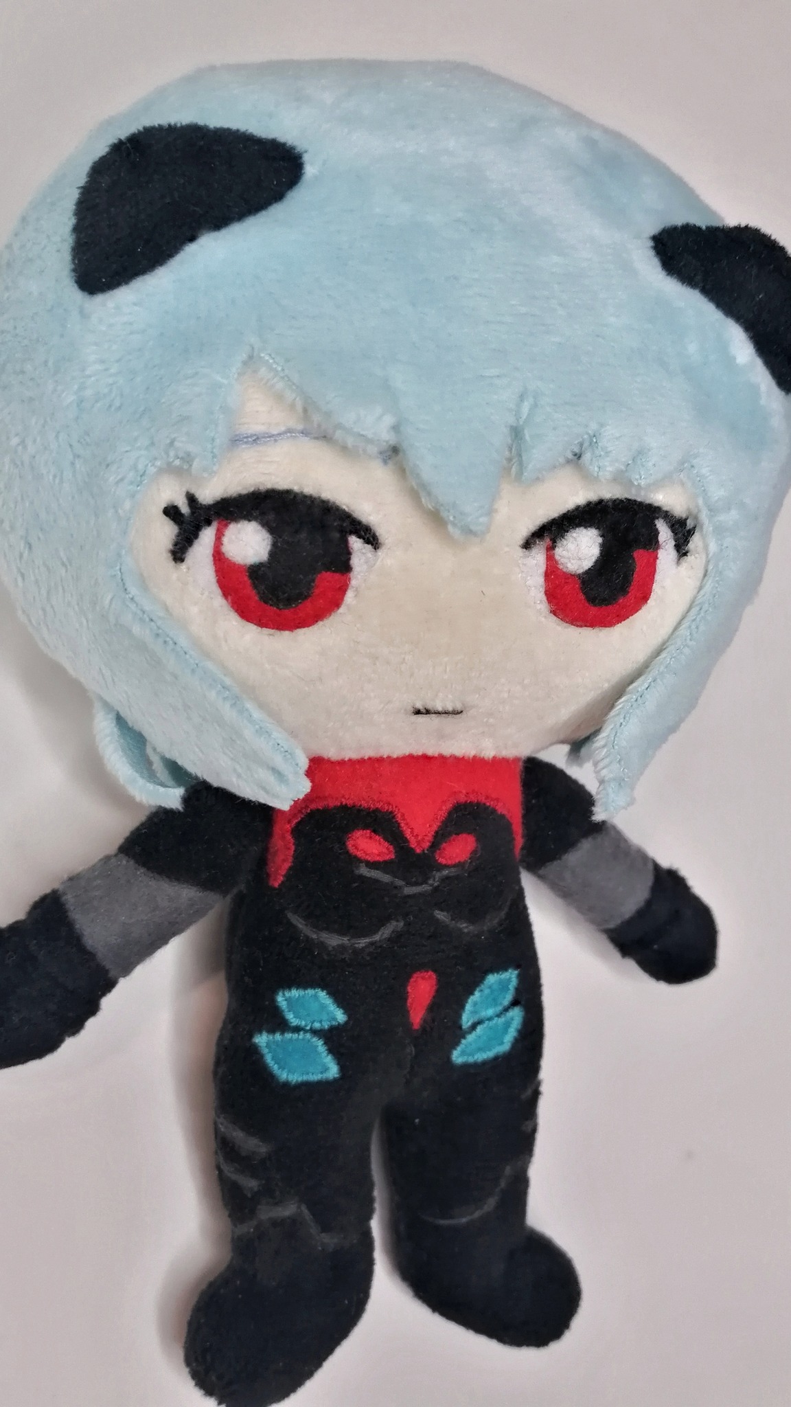 Rei Ayanami plush with embroidered red eyes and light-blue plush hair, custom anime plush sewn to order