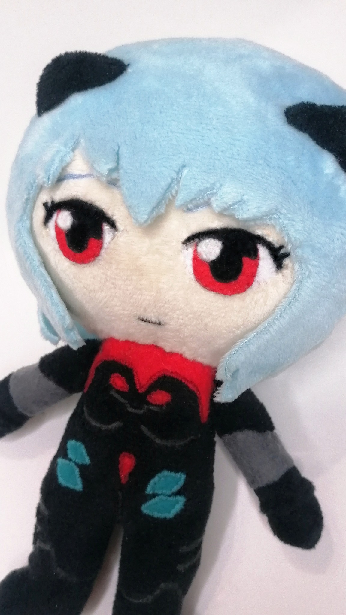 Rei Ayanami plush with a red shield and zero sewn on the back of her plugsuit, custom Evangelion plush to order