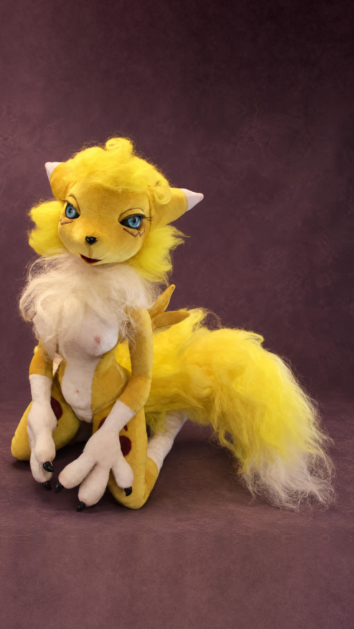 Handmade Renamon art doll kneeling, with a white faux-fur ruff and purple yin-yang marks, a custom Digimon doll