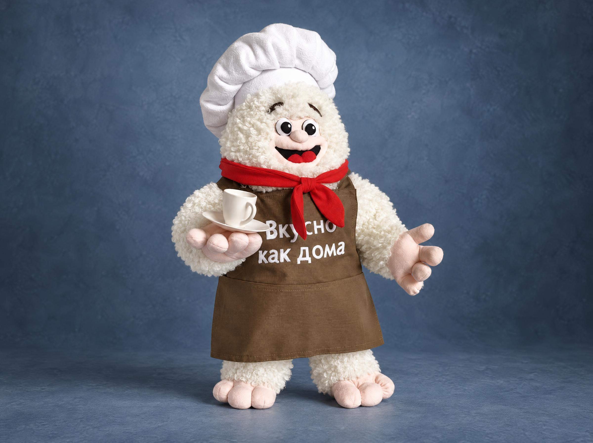 Restaurant mascot plush: smiling curly white chef with a cup of tea and a brown apron, handmade to order