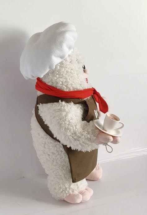 Custom restaurant mascot plush with a teacup Custom restaurant mascot plush with a teacup on a saucer, white chef hat and curly faux fur, handmade to order
