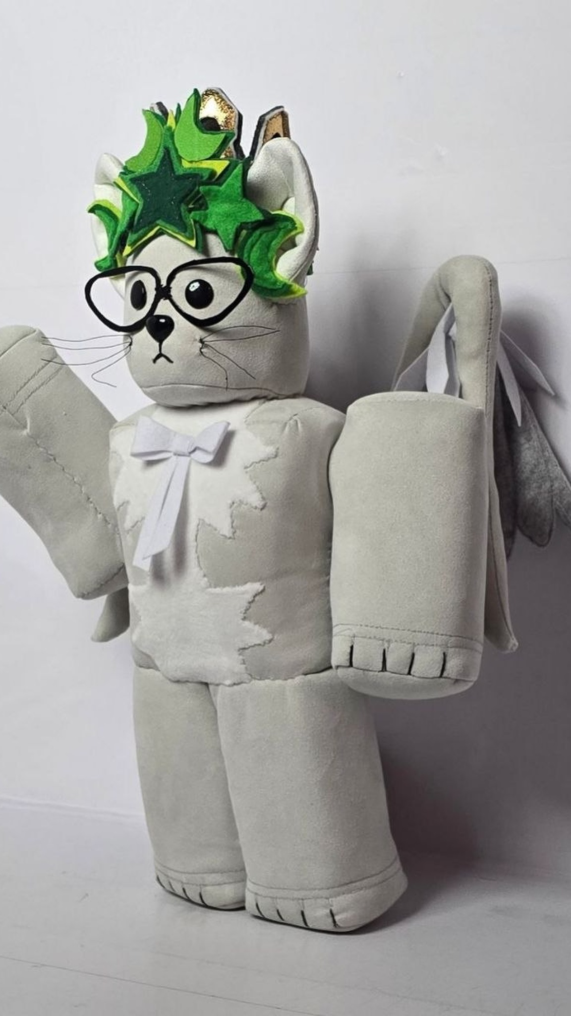 Custom Roblox cat plush with a green felt star crown and black glasses, sewn by hand from a player's avatar