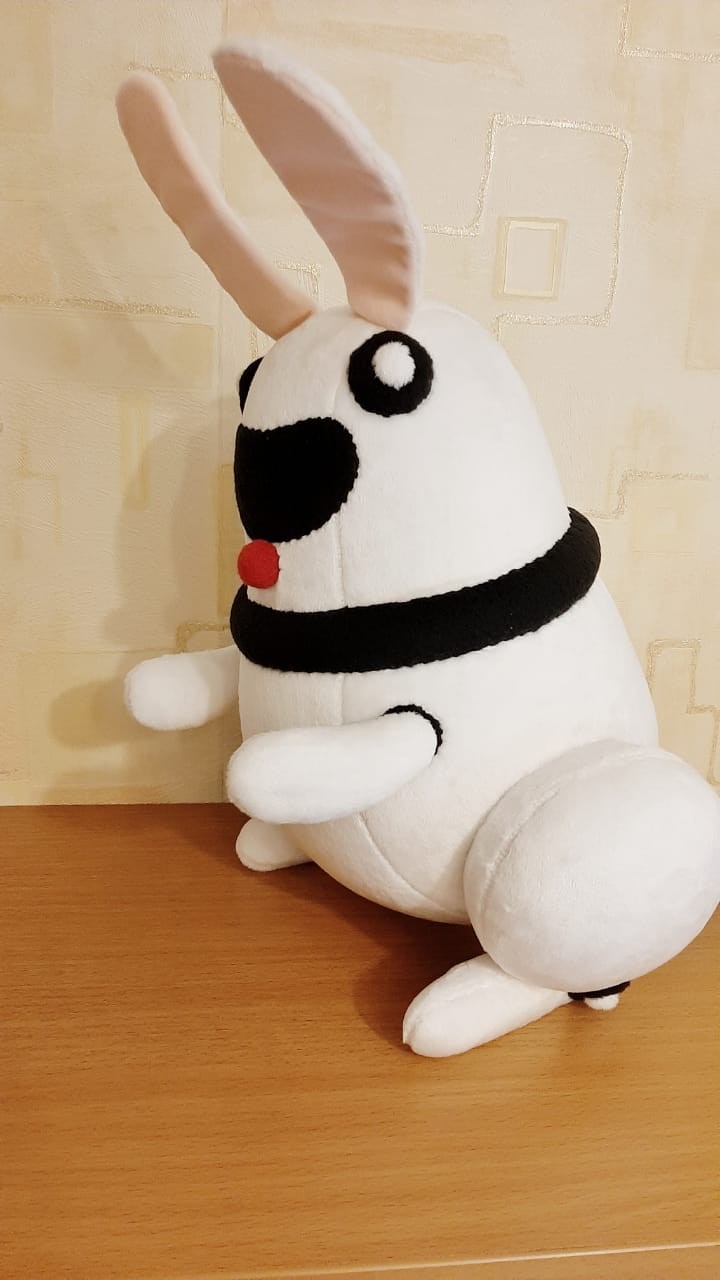 White robot bunny plush with a black collar White robot bunny plush with a black collar ring and pink-lined ears, handmade from vector art