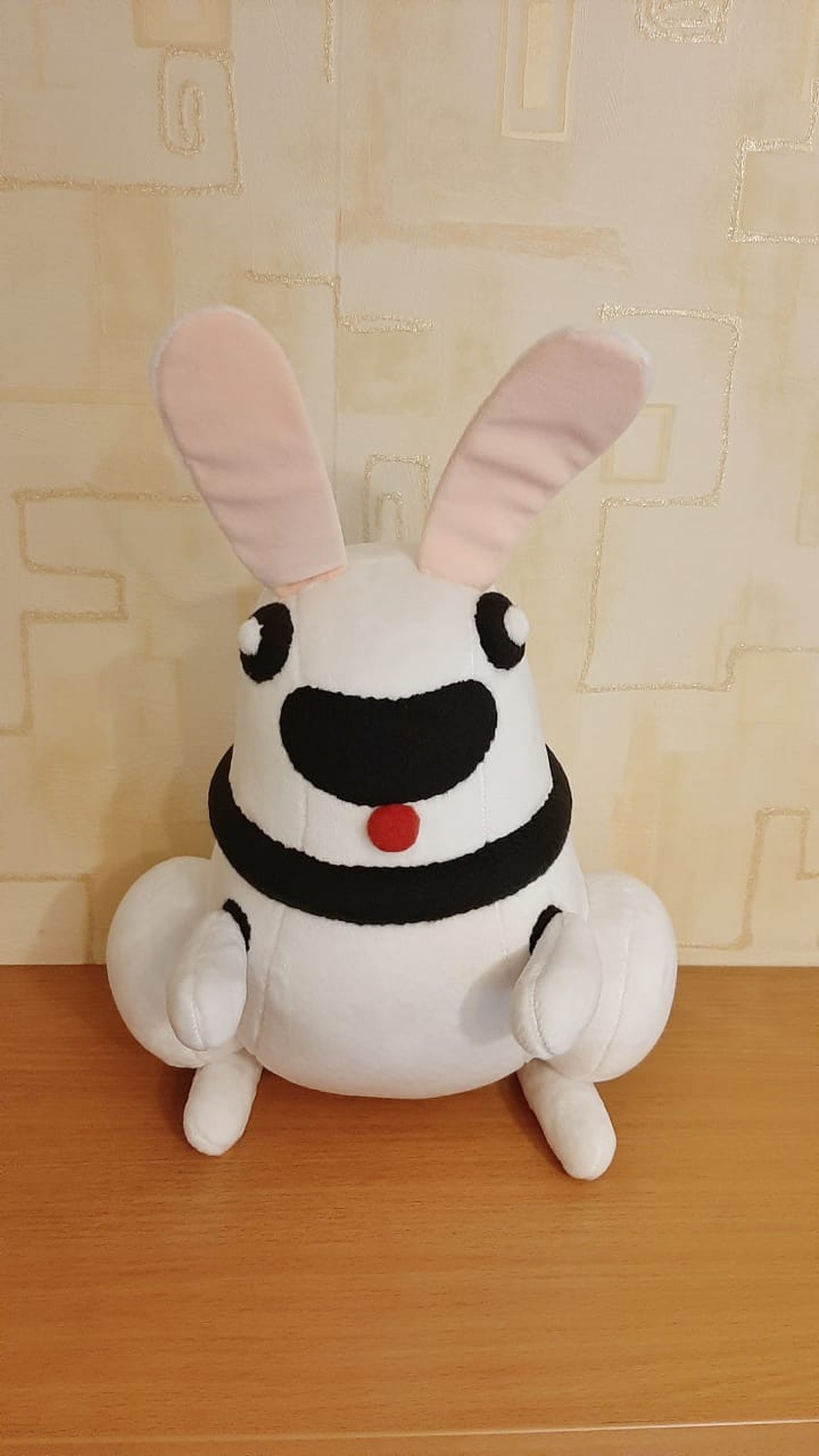 Robot bunny plush with a black grin visor and black collar, sewn to order