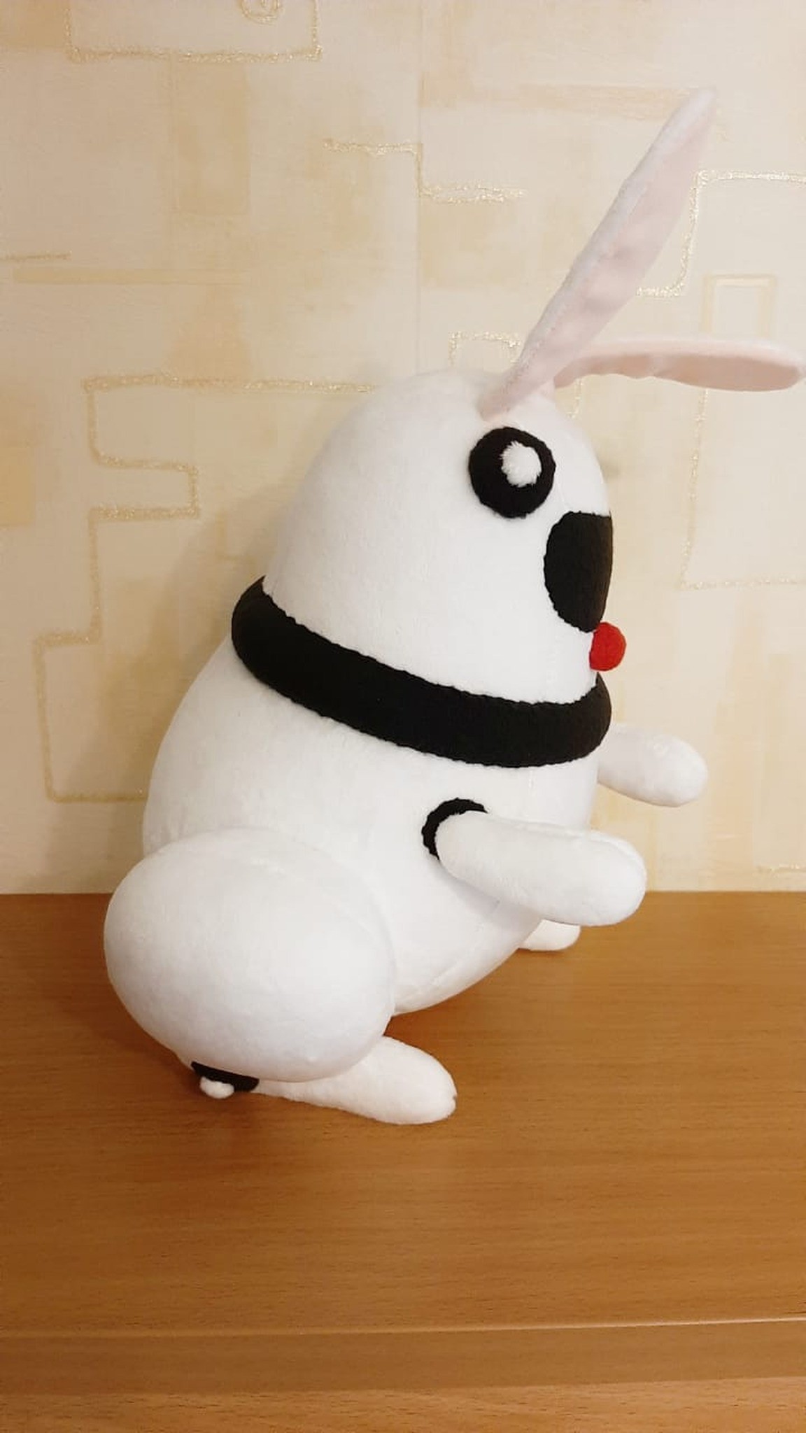 Custom robot bunny plush with a black visor and big white haunches, sewn to order