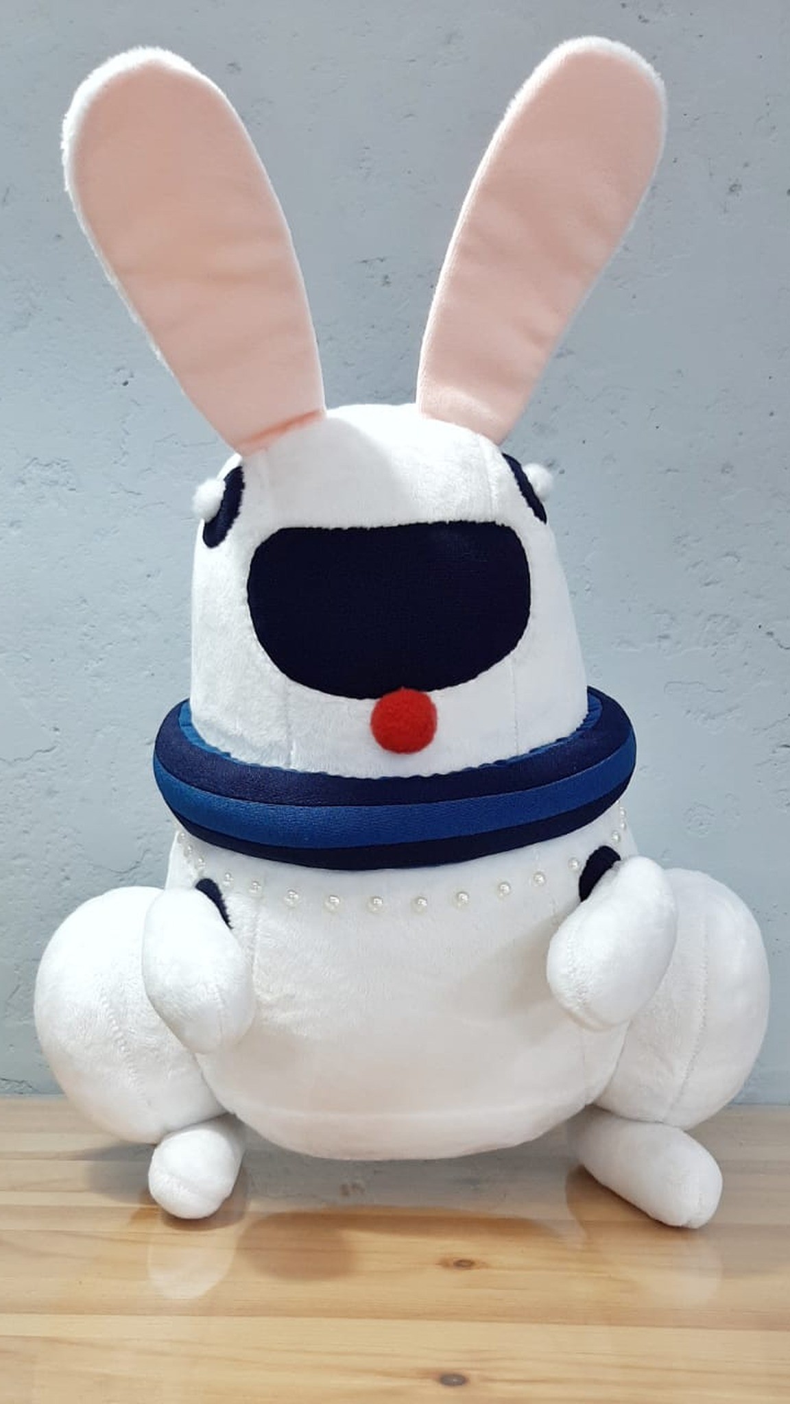 Robot bunny plush with a navy visor, navy collar and pearl beads, made to order