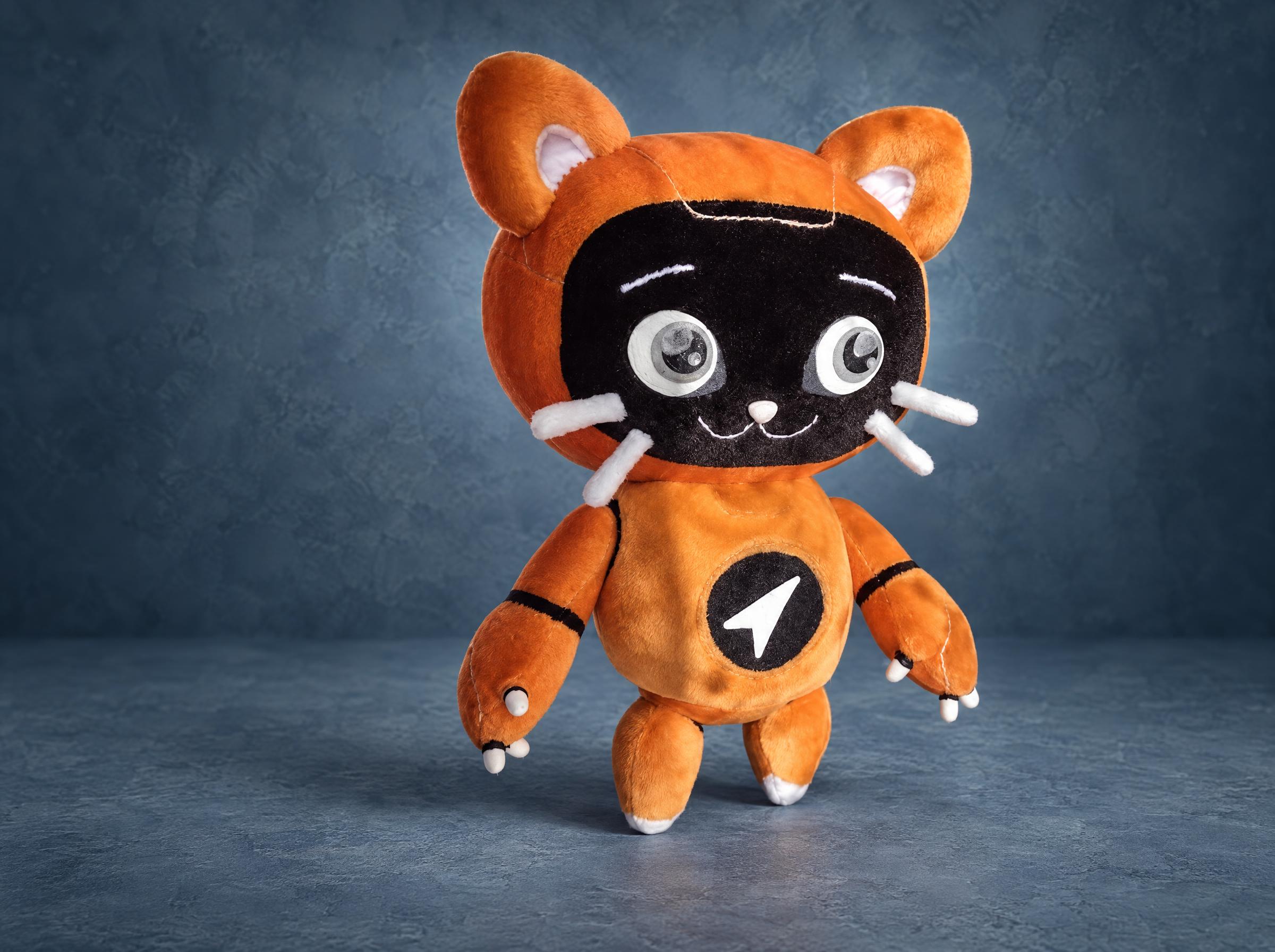 Custom logo plush: orange robot cat mascot with a round logo on its chest, handmade to order