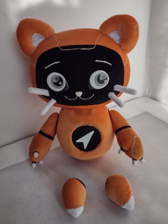 Robot cat plush with magnetic legs Robot cat mascot plush with its magnetic legs taken off, sitting with the logo on its chest, handmade