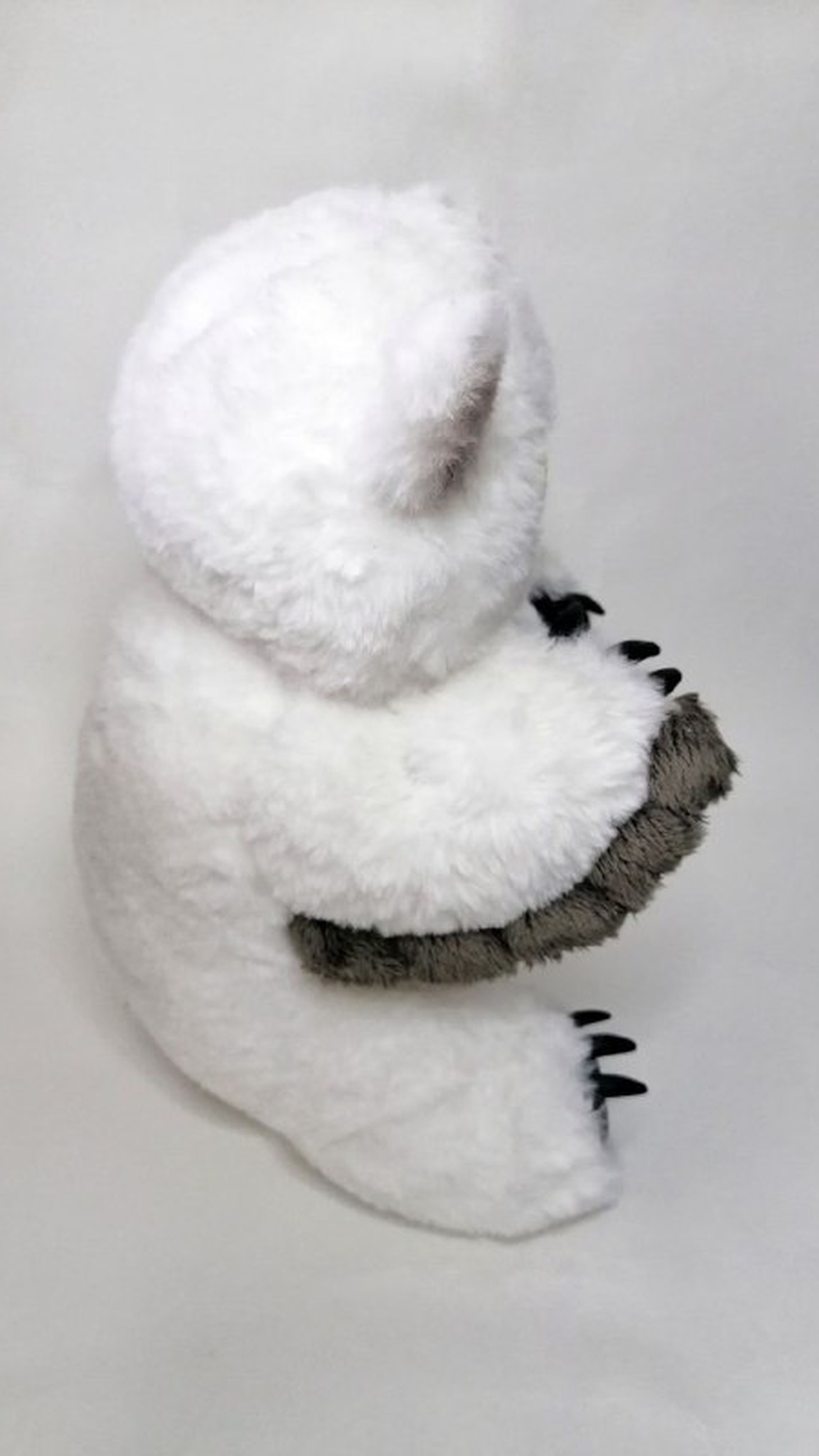 Scared owlbear plush sewn to order: round white faux fur back, grey-tipped ears and a grey feather fringe