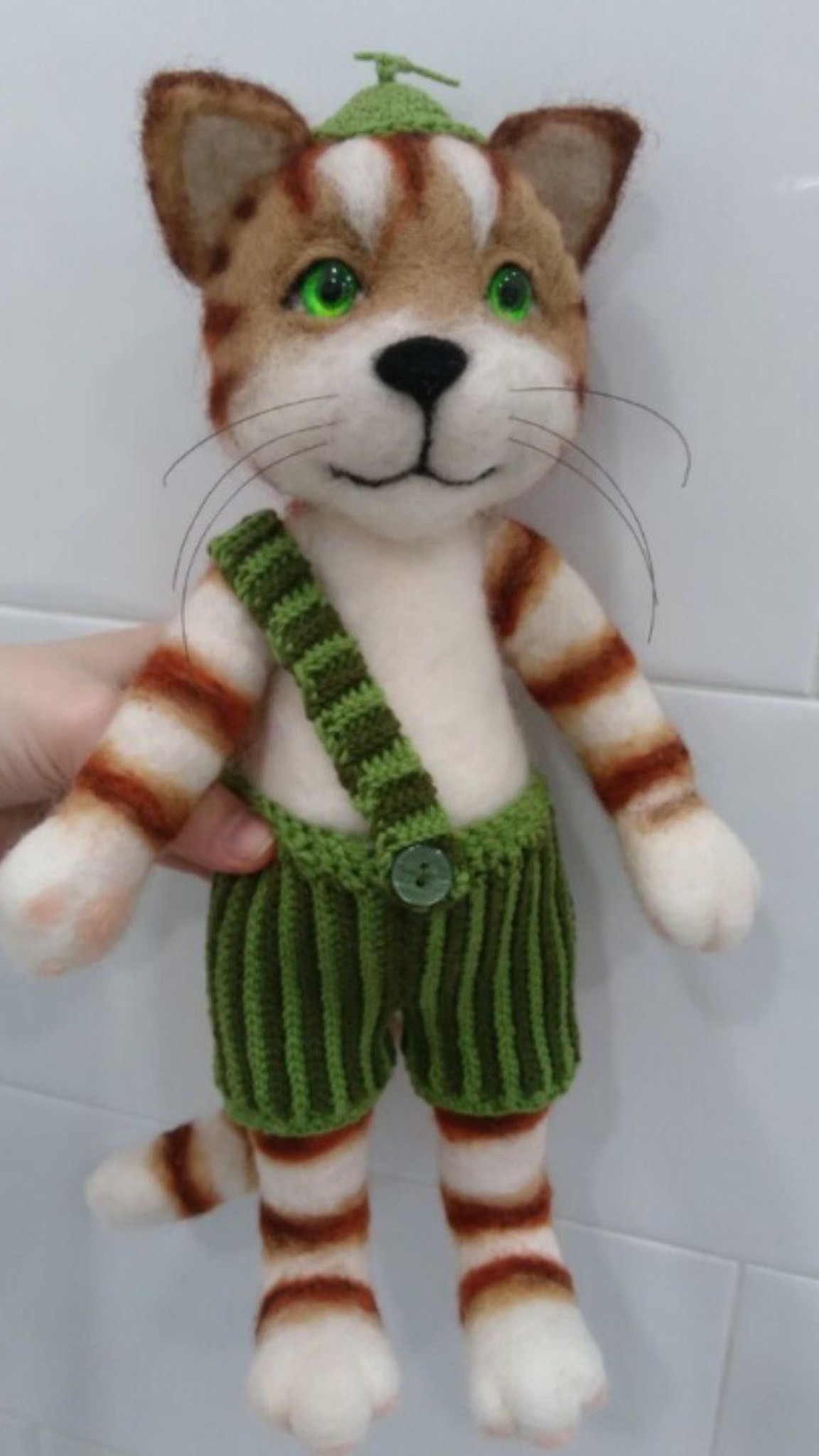 Second needle felted Findus cat toy with a tan striped head and ribbed knit trousers, handmade to order