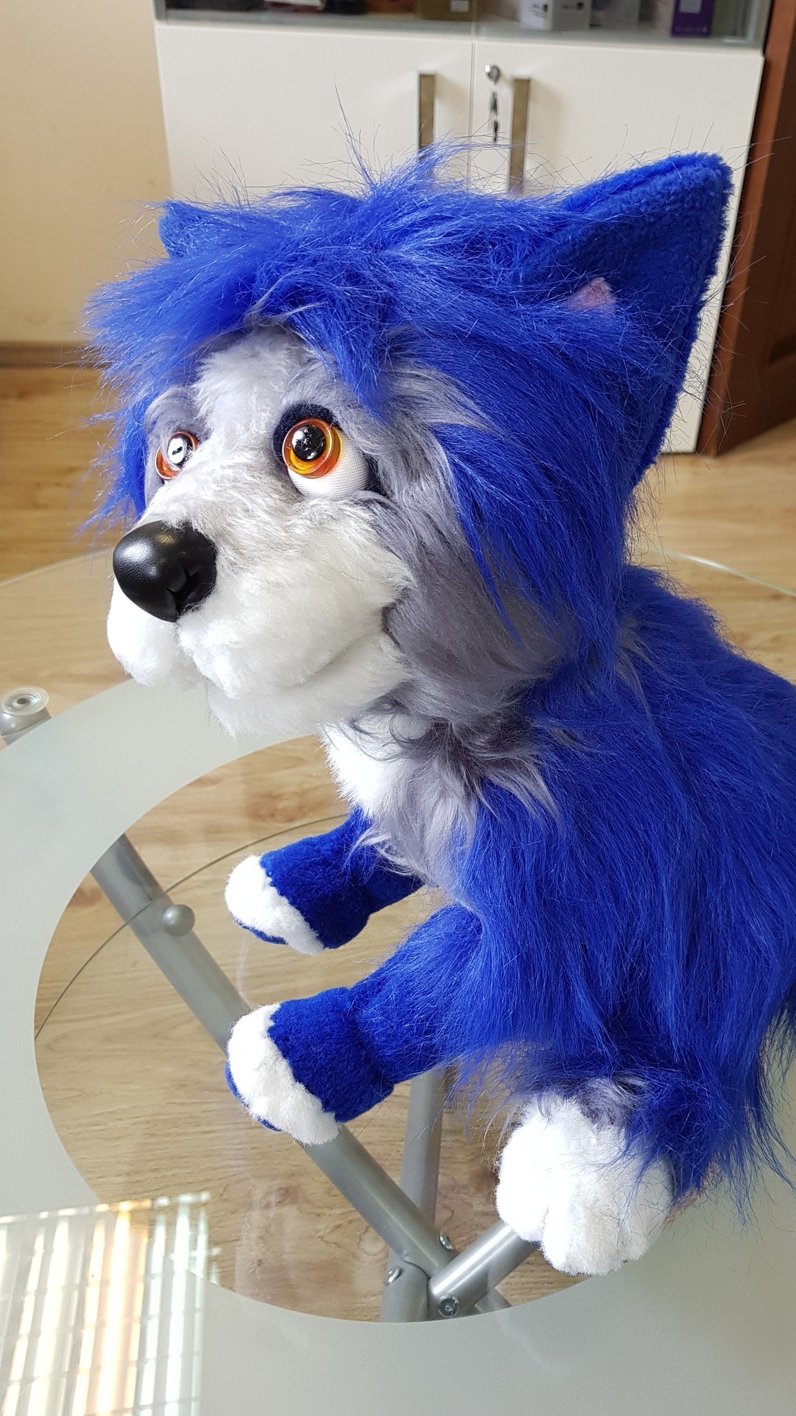 Shaggy blue dog plush sitting with white-tipped paws and tall blue ears, handmade to order