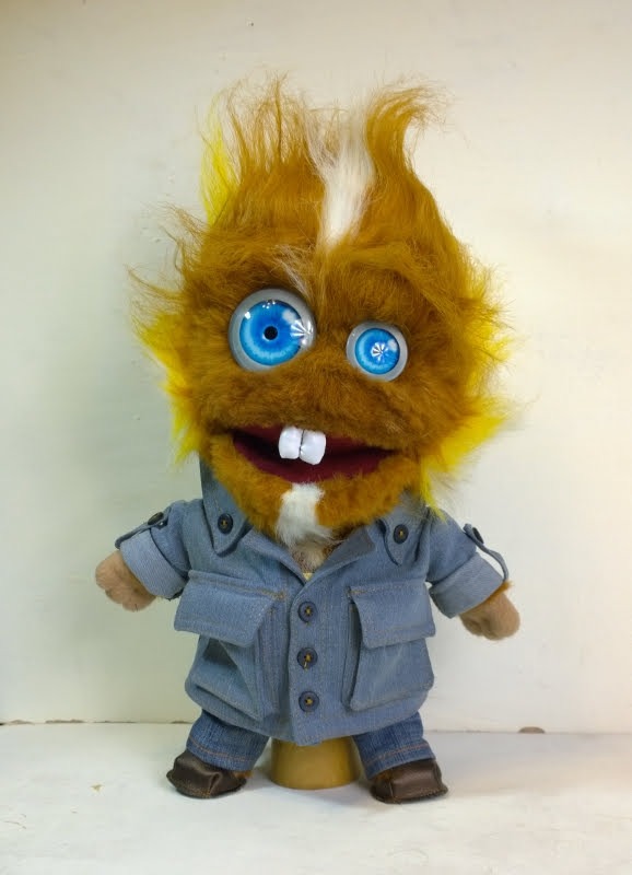 Shaggy monster plush in a denim jacket Shaggy monster plush in a buttoned denim jacket, ginger faux fur with yellow tips, handmade to order
