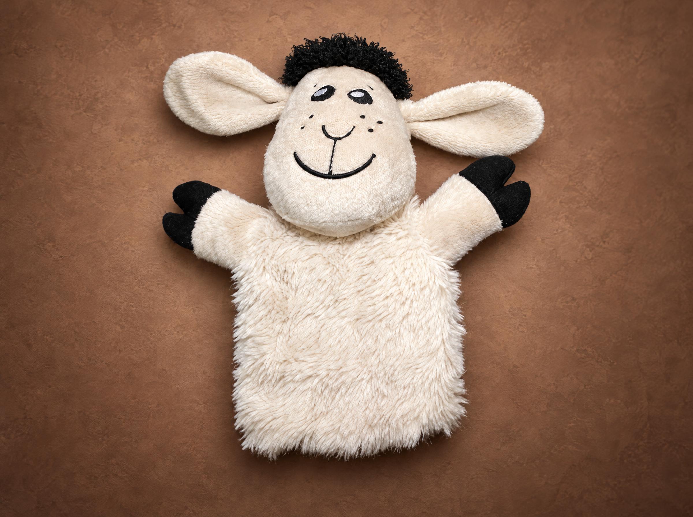 Custom sheep hand puppet with cream faux fur, curly black tuft and black hooves, sewn to order in a batch