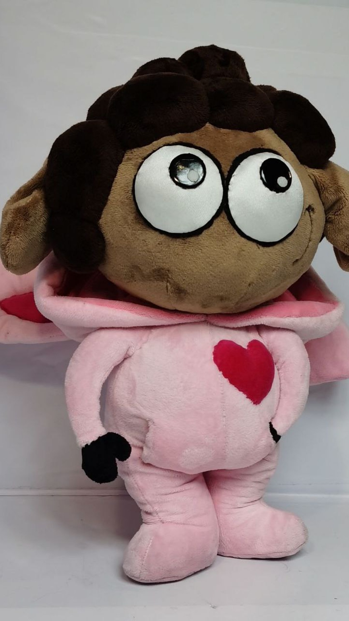 Sheep plush with the pink hood down, showing dark curly hair and big white eyes, sticker toy made to order