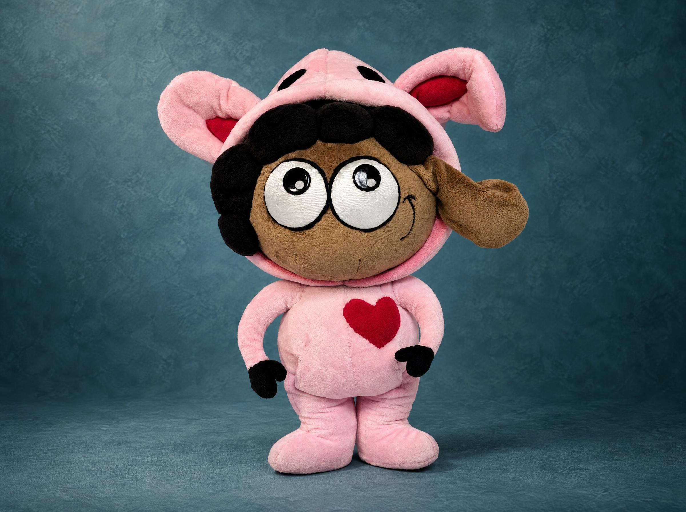 Sheep plush made to order from a sticker: Lana in a pink bunny-ear onesie, dark curls, red heart on her tummy