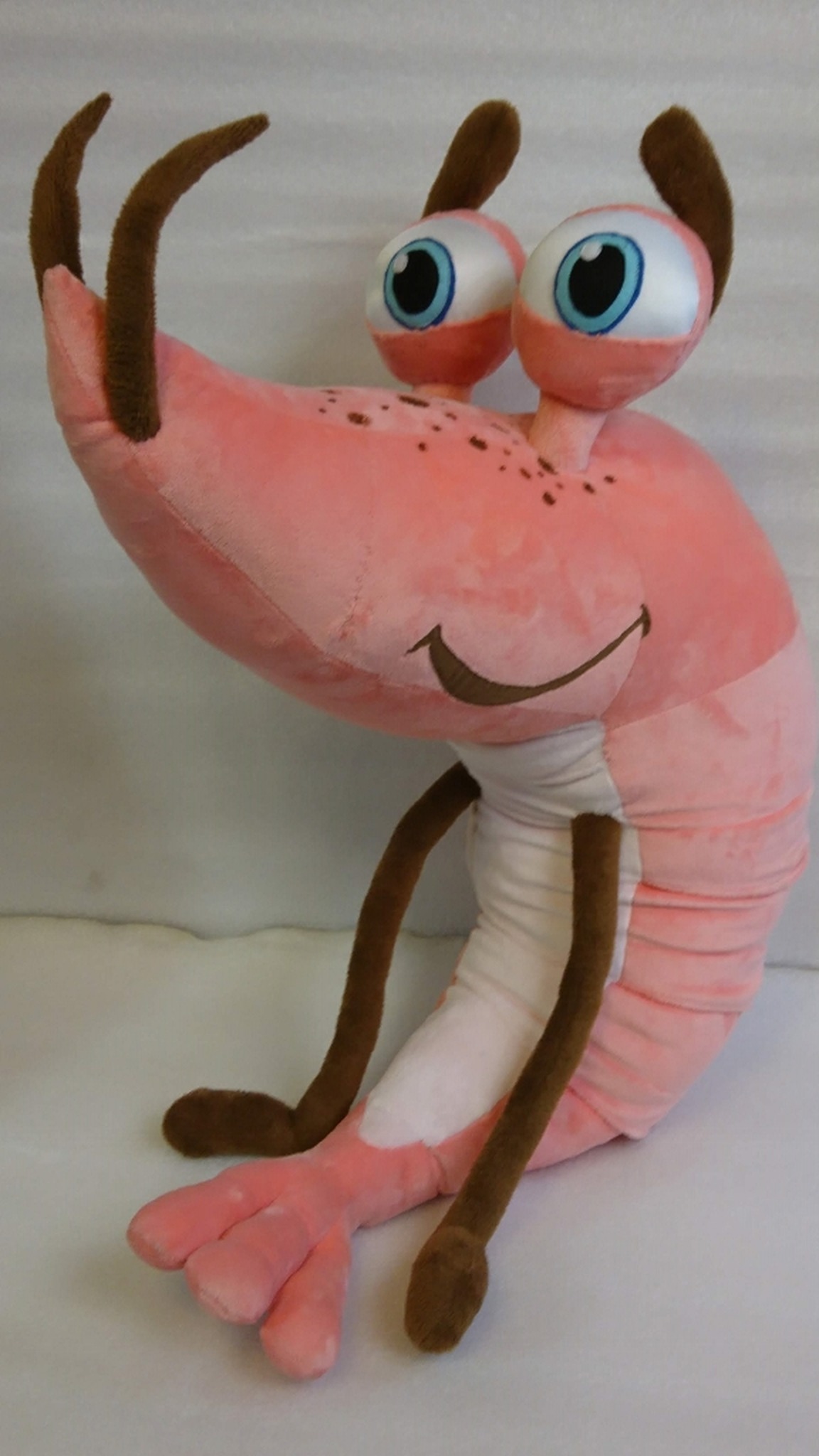 Shrimp plush mascot with big blue eyes on stalks, brown eyebrows and a wide smile, custom made to order