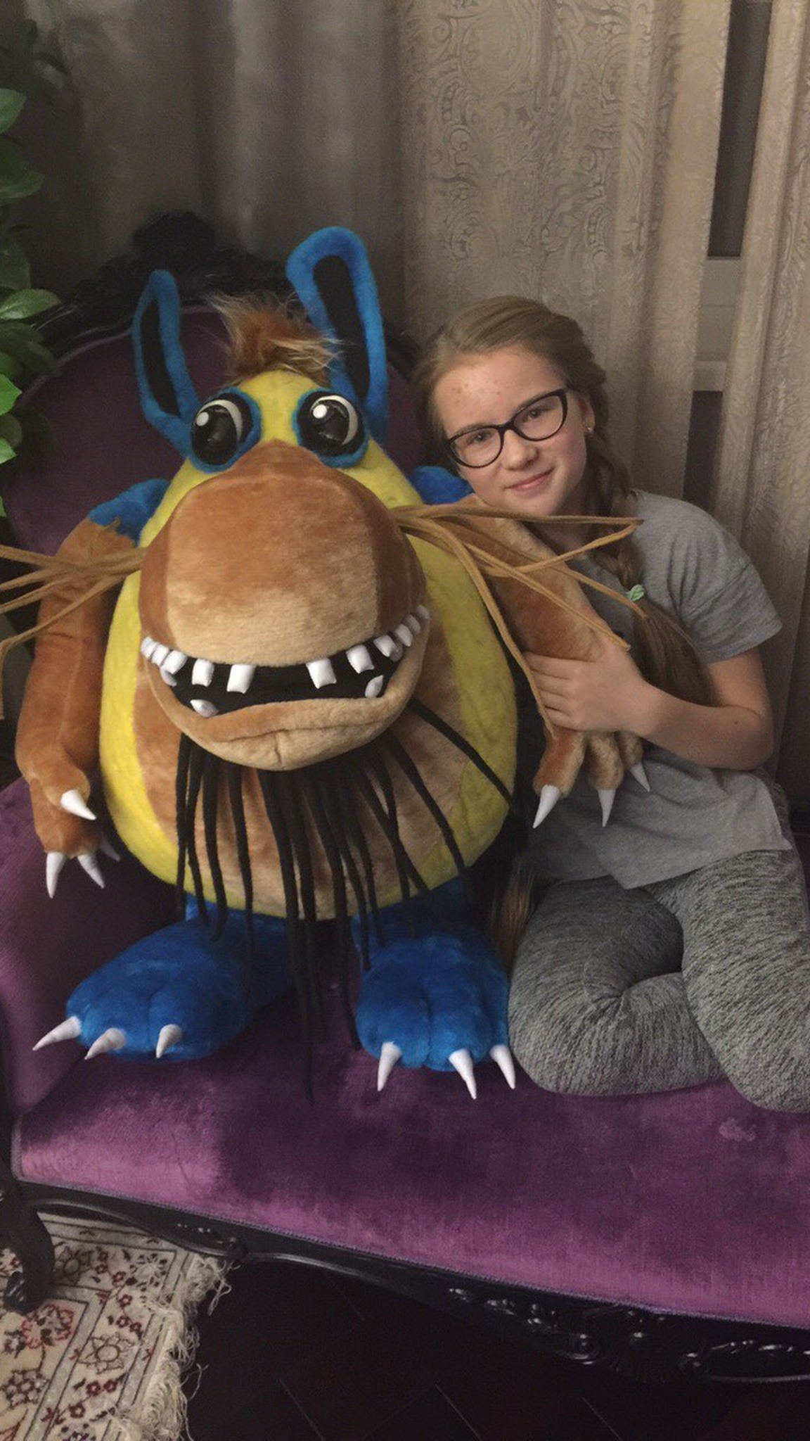 Shtusha-Kutusha big monster plush with the young fan it was made for, sewn to order from the cartoon
