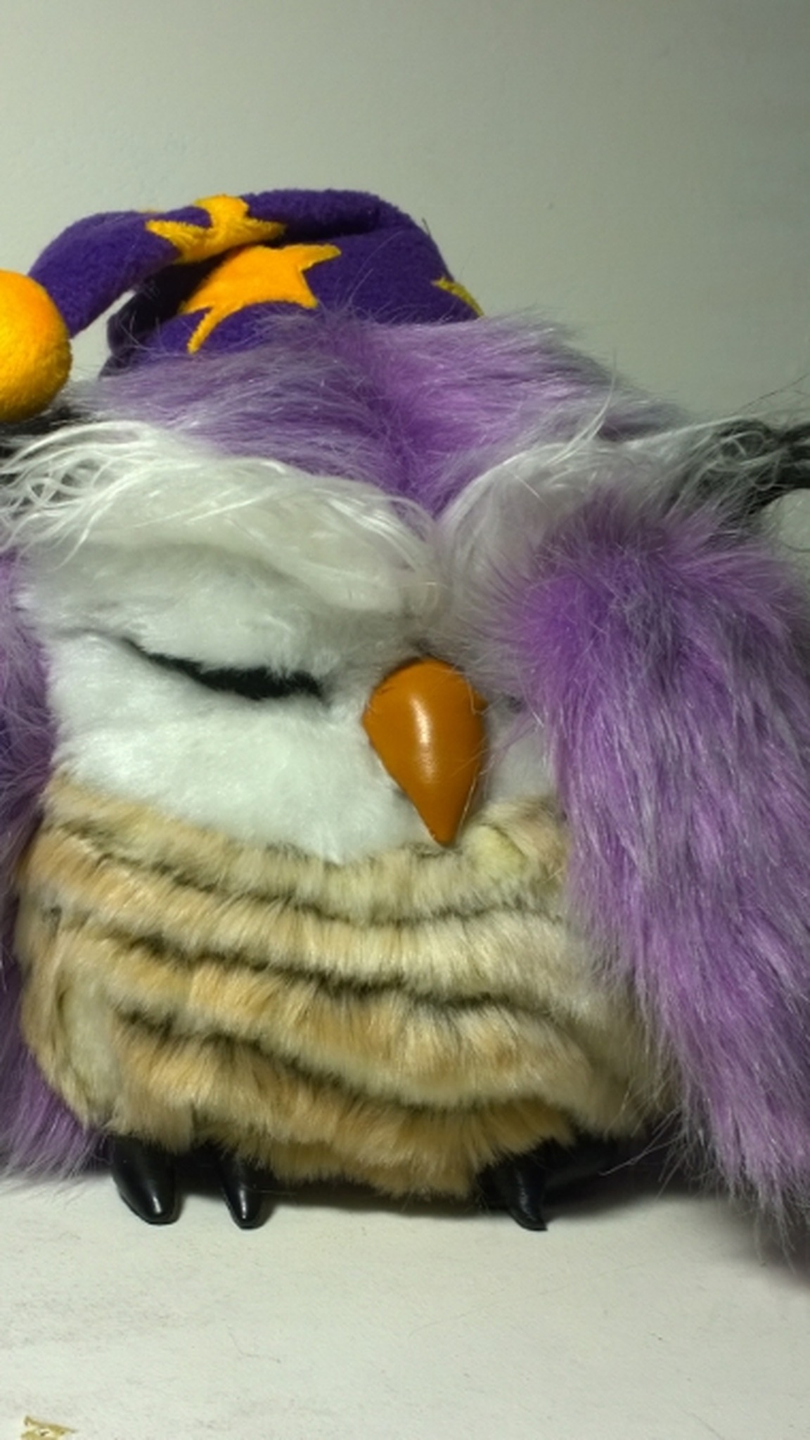 Sleeping owl plush with a crooked purple nightcap, long lilac faux fur wings and a beige striped belly, handmade