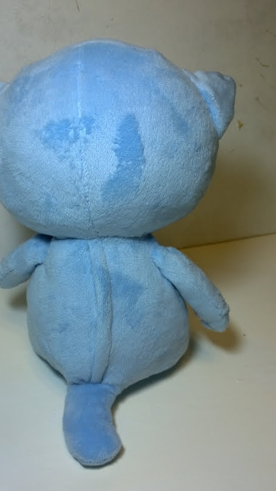Blue sleepy cat plush with a short tail and big round head, handmade anime kitten to order