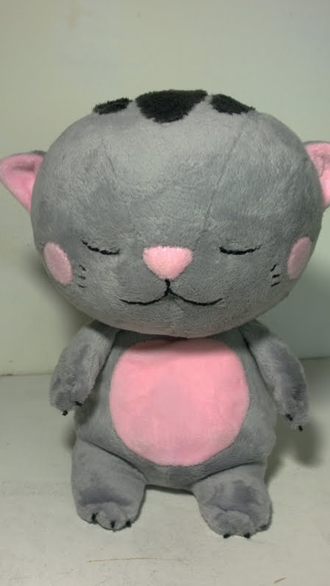 Grey sleepy kitten plush with pink nose, pink belly and dark patches on its head, made to order