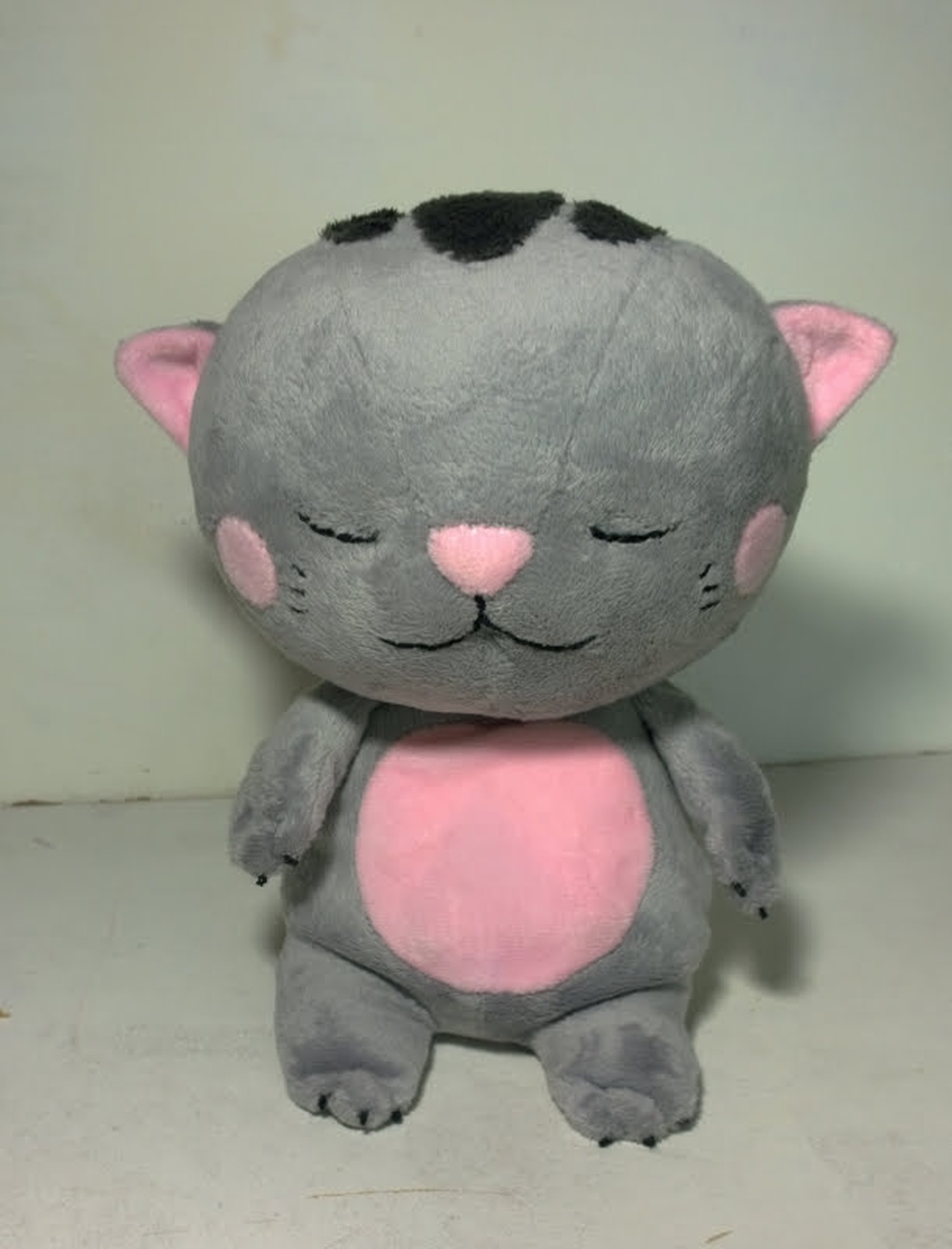 Grey sleepy kitten plush with a pink belly Grey sleepy kitten plush with dark head patches, pink nose, pink belly and stitched claws, sewn to order
